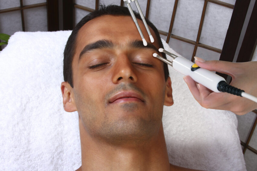 Man receiving a facial CACI treatment