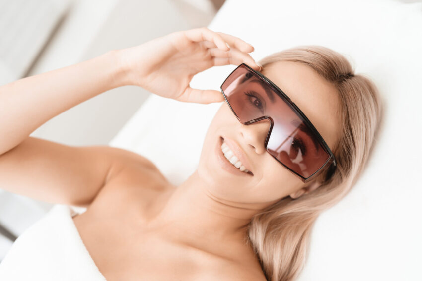 Woman smiling wearing protection glasses