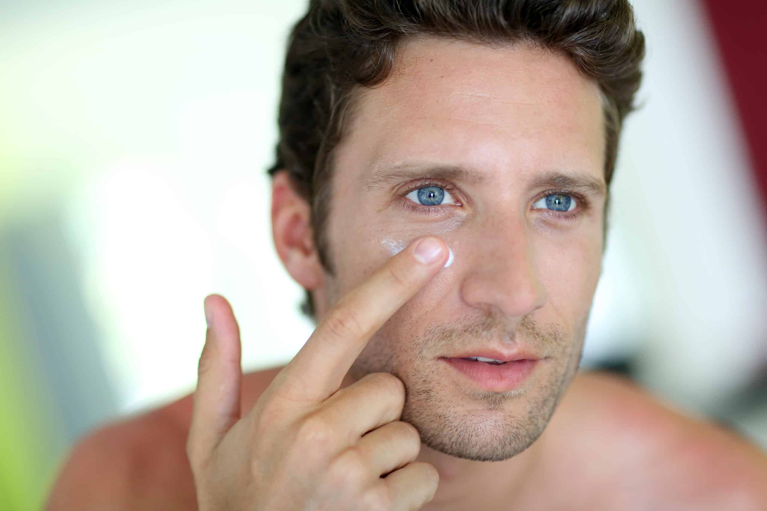Man applying skincare